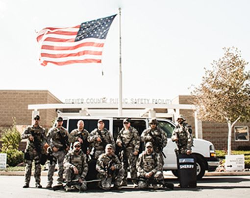 Police Staff Standing in front of Public Safety Facility